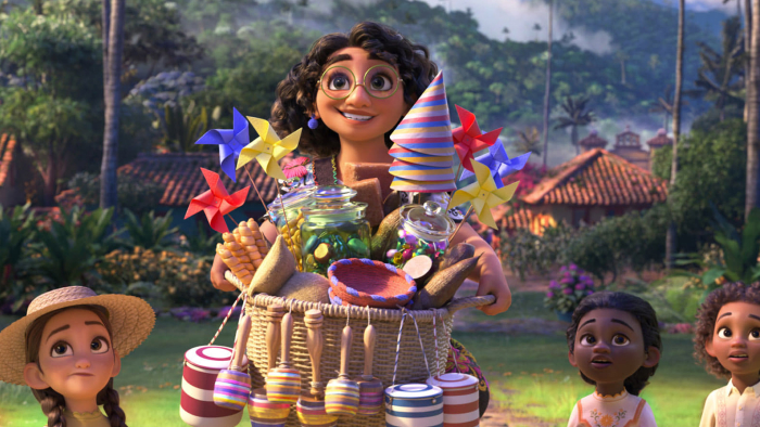 Encanto's Mirabel carries party supplies with other kids around her.