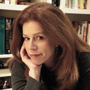 Portrait of Common Sense Media's founding editor-in-chief, Liz Perle, a white woman with long auburn hair.